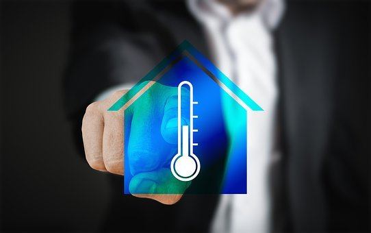 a man pointing to a temperature icon