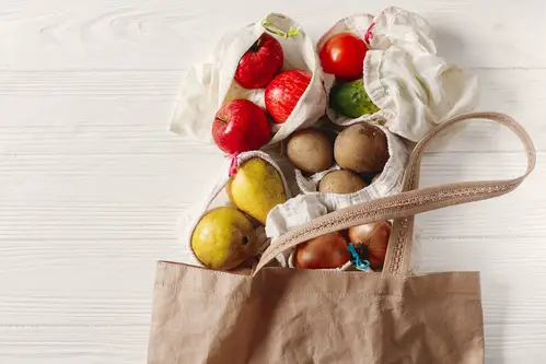 zero waste food shopping. eco natural bags with fruits and veget