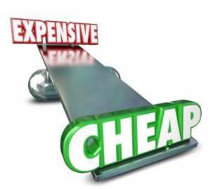 Cheap Vs Expensive 3d Words on a scale or balance to illustrate or compare prices or costs to find the best deal, bargain or value