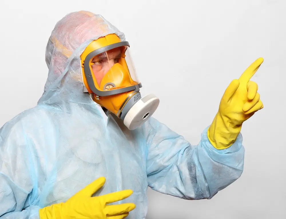 Man in protective clothing with respirator. Infection control concept.