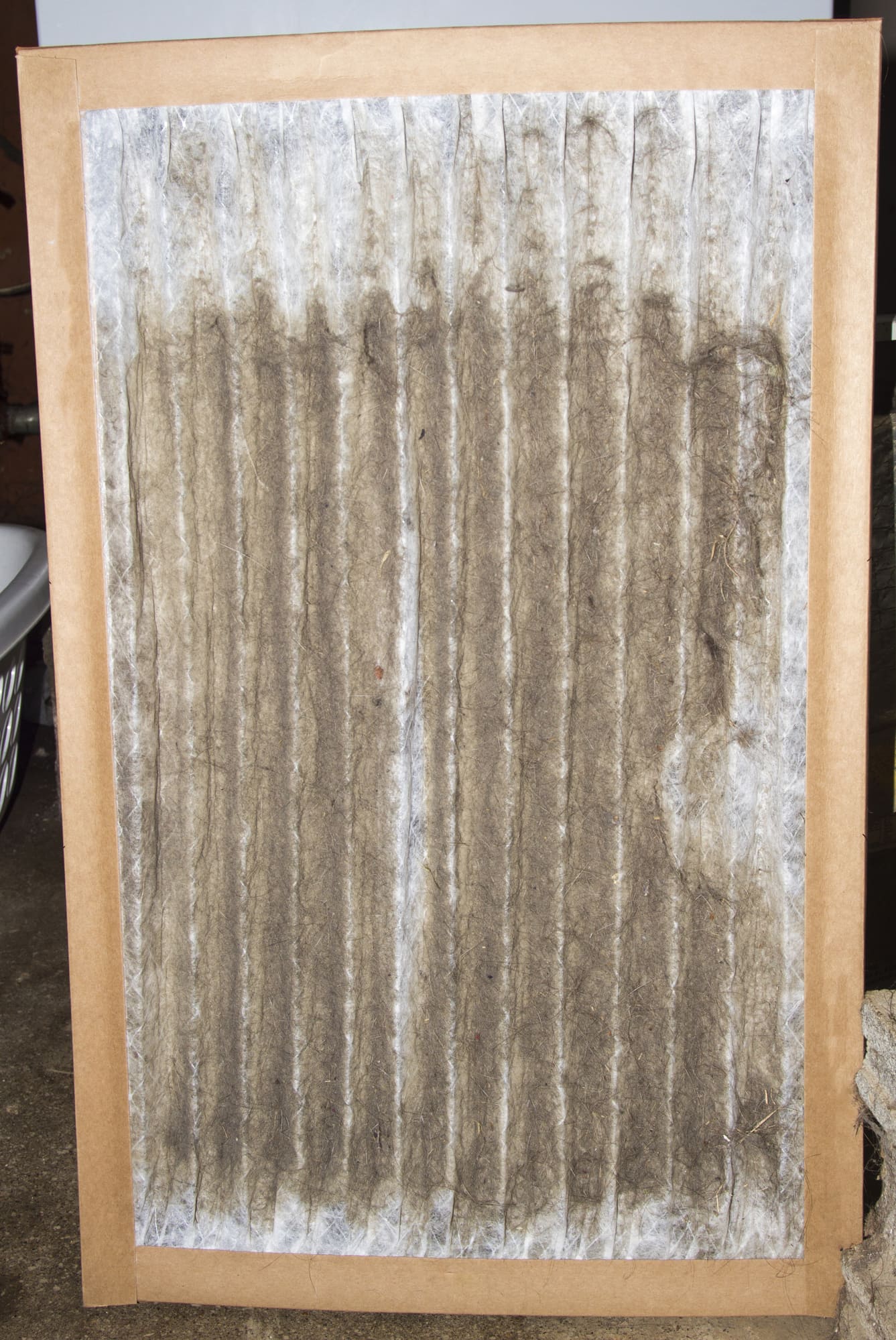 Front view of a dirty furnace filter taken out 