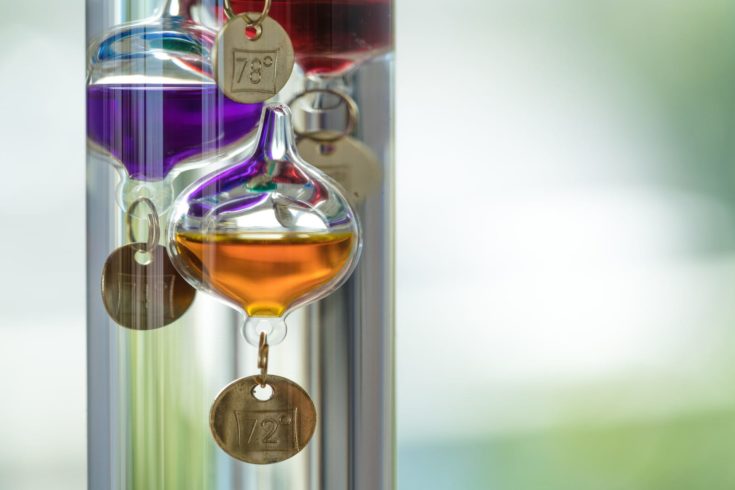 A Galileo thermometer uses different densities of liquids in glass bubbles to determine temperature